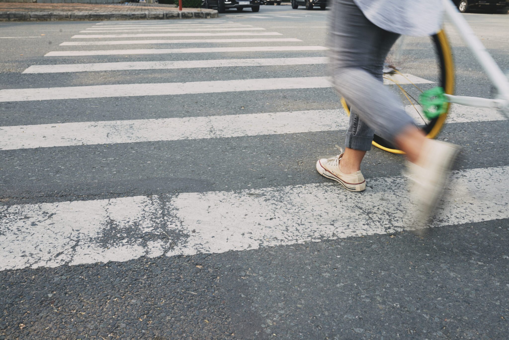 Female cyclist on zebra crossing, blurred motion, Pedestrian Accident