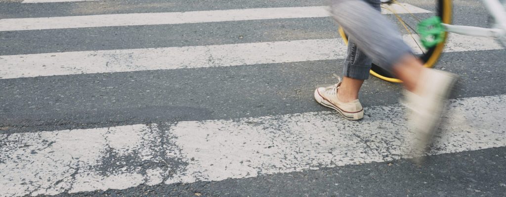 Female cyclist on zebra crossing, blurred motion, Pedestrian Accident